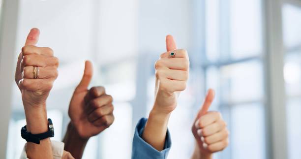istock Employees, hands and thumbs up in office for approval, team support and motivation for goals. Business people, emoji and symbol for like feedback in workplace, cooperation and staff for collaboration 2172939902