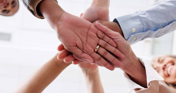 istock Business people, palm and stack in huddle for teamwork, office support and motivation for goals. Employees, hands pile and circle for collaboration in workplace, mission solidarity and low angle 2172939924