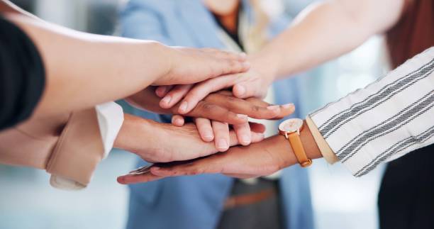 istock Employees, hands and stack in huddle for team building, office support and motivation for goals. Business people, pile and circle for staff collaboration in workplace, solidarity and meeting closeup 2172939939