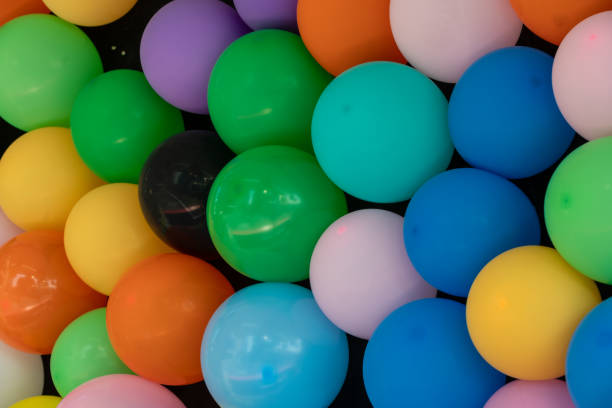 istock Colorful balloons on black background for games 2172942322