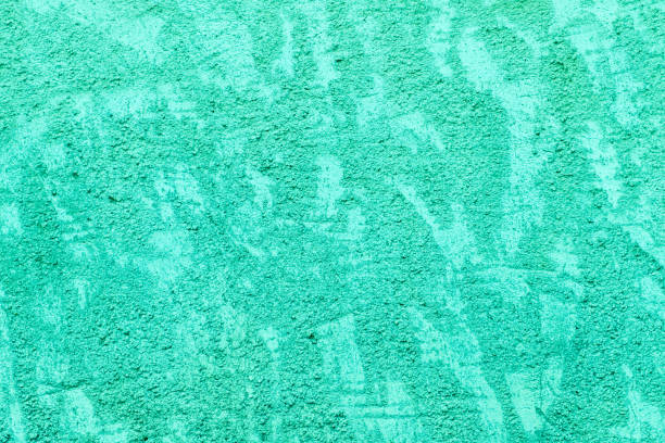 Old concrete wall with rich texture, tinted green