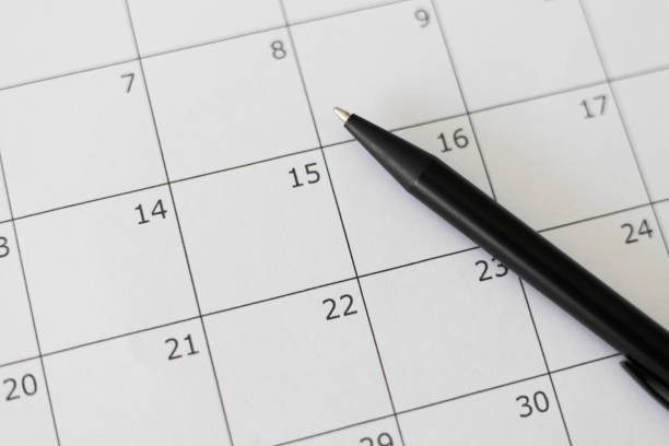 istock Calendar close up. Blank calendar with and a pen 2172944773