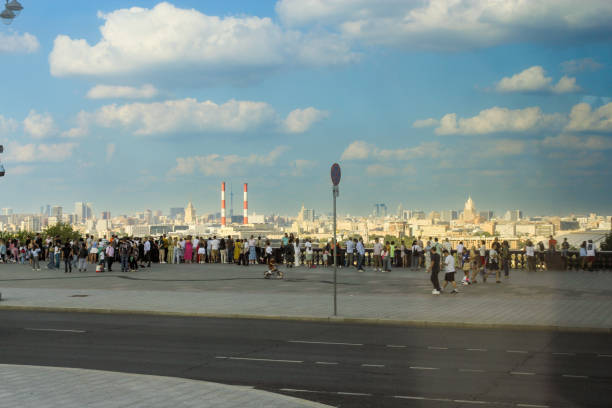 Moscow, Russia - 25, August, 2024.\nBus tour of interesting places and streets of Moscow.\nA crowd of people on the observation deck on Vorobyovy Gory.