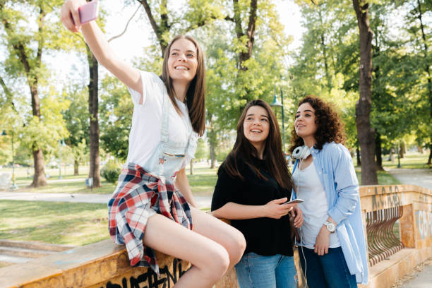 istock Teenagers taking selfie in the park 2172947752