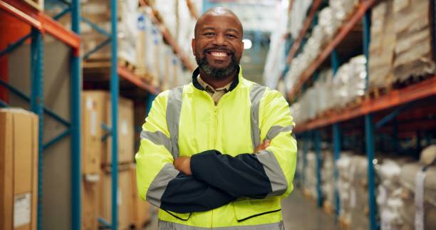 istock Portrait, black man and confident at warehouse for distribution, logistics industry and package inventory. Male person, arms crossed and inspection for supply chain, freight and safety of production 2172947843