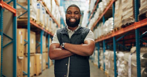 istock Portrait, confident and black man at warehouse for distribution, logistics industry and package inventory. Worker, arms crossed and inspection for supply chain, freight and transport of production 2172947854