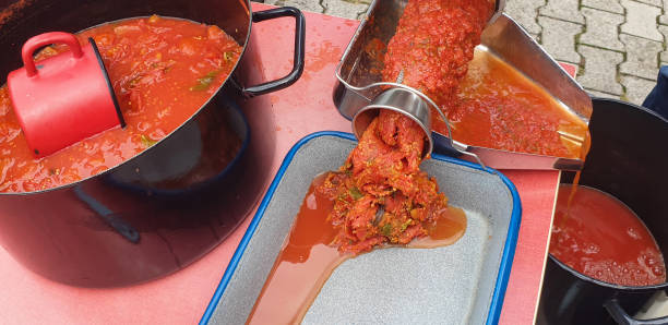 istock Grinding tomatoes for homemade mash, pulp 2172957432