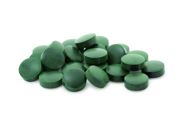 istock Green tablets of spirulina or chlorella 2172962206
