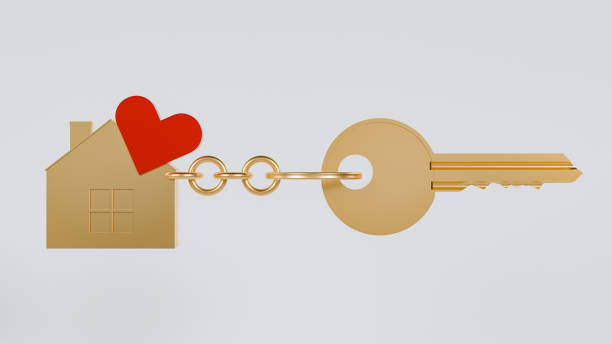 istock A golden key with a house-shaped keychain, adorned with a red heart 2172964285