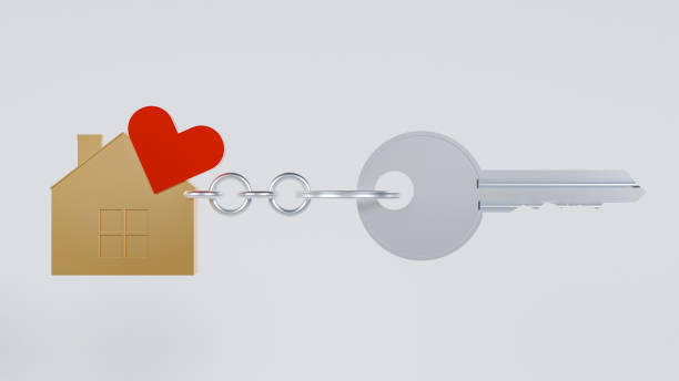 istock A silver key with a house-shaped keychain, adorned with a red heart 2172965069