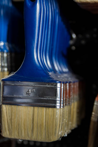 Number Four Blue Plastic-Handled Brushes On The Brush Shelf