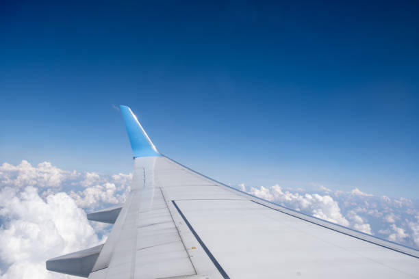 istock View from the airplane window of the wing and winglet soaring through 2172967906