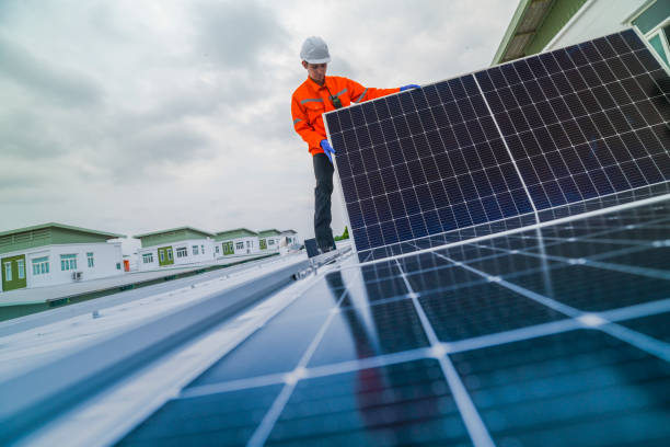 istock engineer man inspects construction of solar cell panel or photovoltaic cell by electronic device. Industrial Renewable energy of green power. factory worker working on tower roof. 2173003948