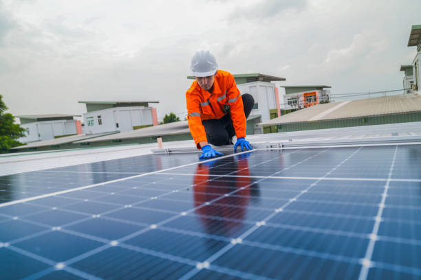 istock close up on grid of technology renewable solar energy. construction solar panels system on roof. Installing solar photovoltaic panel system. background of blue of solar cell system and structure roof. 2173004432