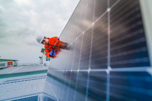 istock engineer man inspects construction of solar cell panel or photovoltaic cell by electronic device. Industrial Renewable energy of green power. factory worker working on tower roof. 2173005713