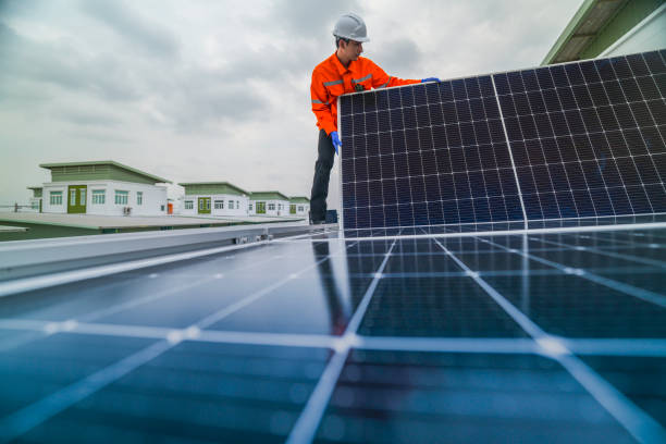 istock engineer man inspects construction of solar cell panel or photovoltaic cell by electronic device. Industrial Renewable energy of green power. factory worker working on tower roof. 2173006297