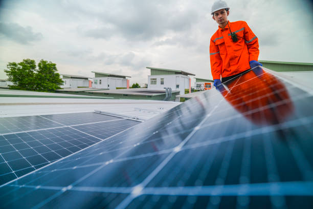 istock engineer man inspects construction of solar cell panel or photovoltaic cell by electronic device. Industrial Renewable energy of green power. factory worker working on tower roof. 2173006852