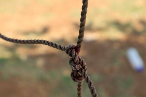 istock Rope, tie knot blurry background. soccer goal net 2173009346