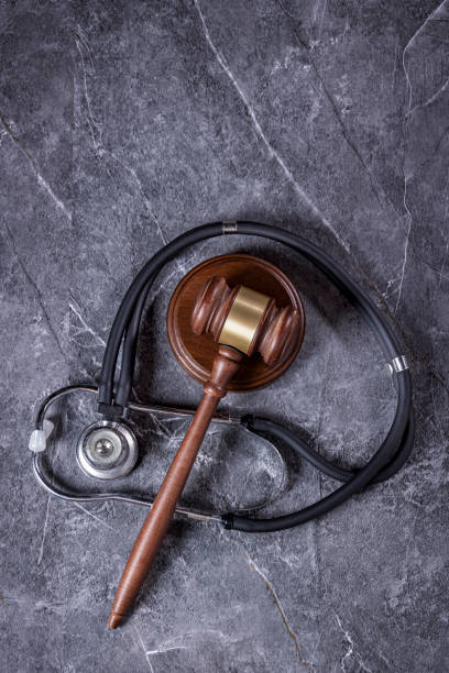 istock Gavel and Stethoscope on a Gray Marble Background 2173009388