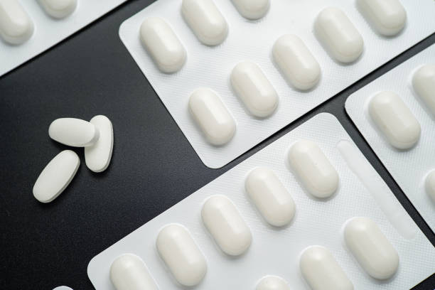 istock Pills Medicine tablet capsules in blister pack on a black background 2173014237
