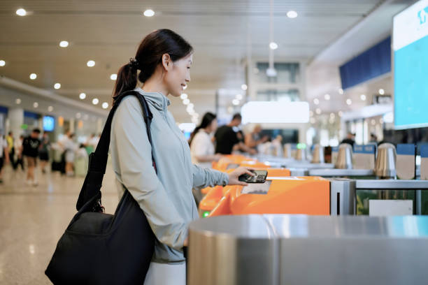 istock Modern Traveler at Airport Turnstile Using Contactless Payment Technology 2173025484