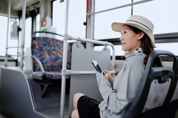 istock Young Woman Enjoying a Quiet Bus Ride While Using Her Phone 2173025705