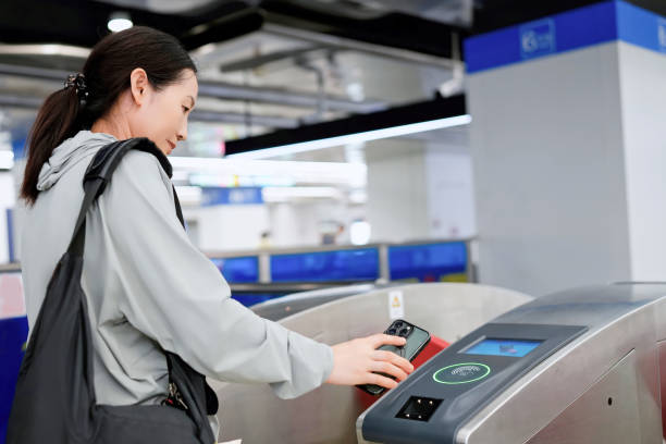 istock Young Woman Using Contactless Payment at Subway Entrance 2173025711