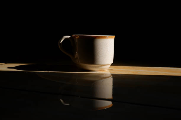 Close up of a ceramic cup isolated on dark background