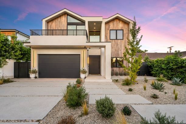 istock Modern house with wooden facade at sunset 2173043815