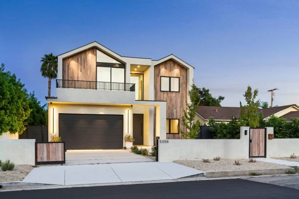 istock Modern house with wooden facade at sunset 2173043876