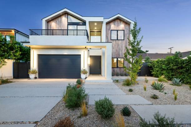 istock Modern house with wooden facade at sunset 2173043880