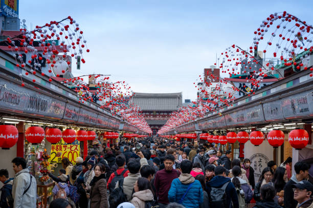 Asakusa, Tokyo, Japan - January 21, 2024:  Many people are shopping on Nakamise street, a famous shopping street in Sensoji temple.