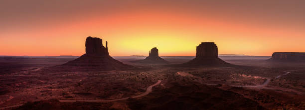 Panoramic view over the Monument Valley after sunset on a summer evening