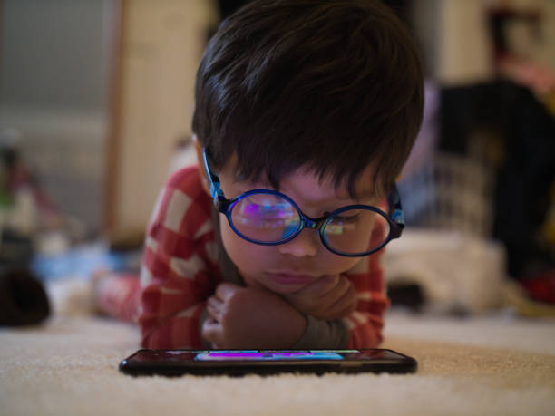 istock boy toddler viewing cartoons on smartphone 2173045170