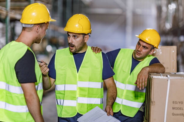 istock Frustrated manual worker arguing with his colleague in a warehouse. 2173051847