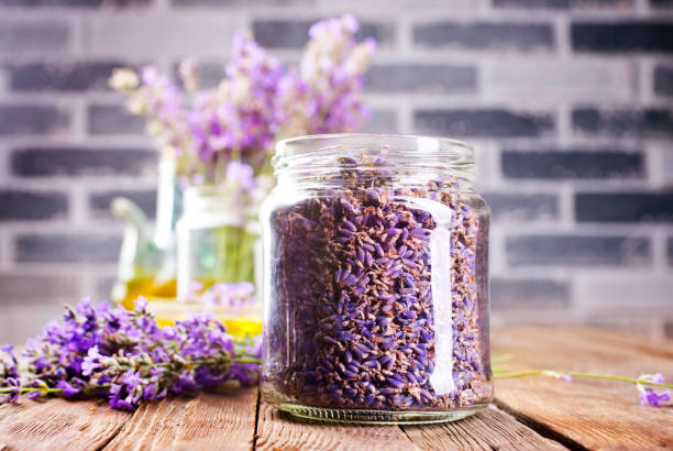 istock Bottle of essential oil and lavender flowers on table. Selective focus. 2173054407