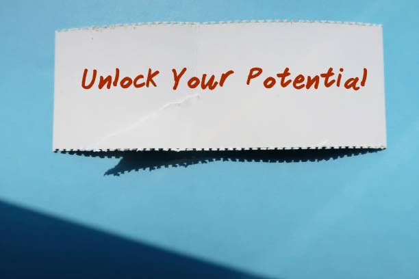 istock Torn paper note on blue background with text written Unlock Your Potential - to discover mindset shifts and actions that can transform to better life 2173058491