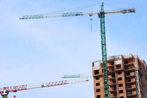 istock Large construction high rise crane, clear blue sky 2173060300