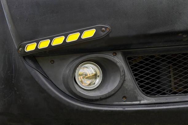 a horizontal bar fixed across the front or back of a motor vehicle to reduce damage in a collision or as a trim