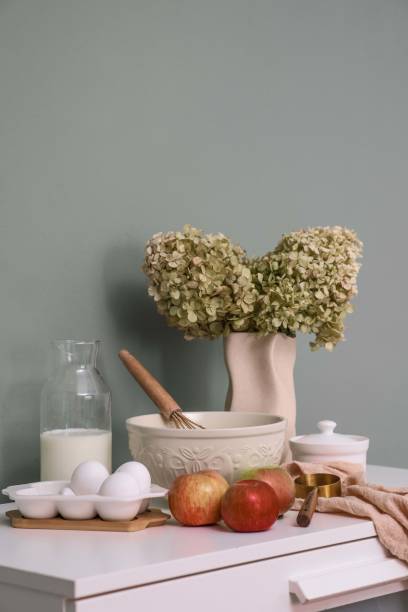 Charming Rustic Kitchen Arrangement Featuring Fresh Ingredients, Colorful Flowers, and More