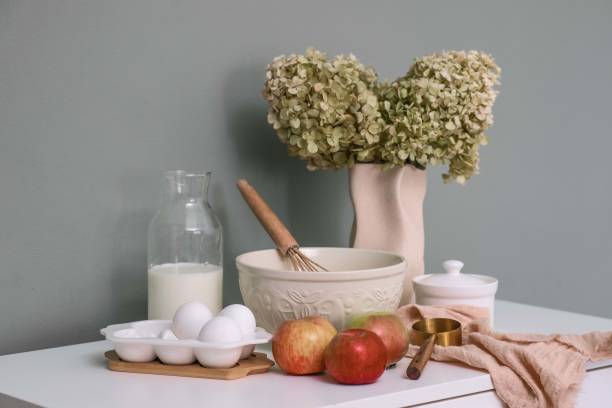 Charming Rustic Kitchen Arrangement Featuring Fresh Ingredients, Colorful Flowers, and More