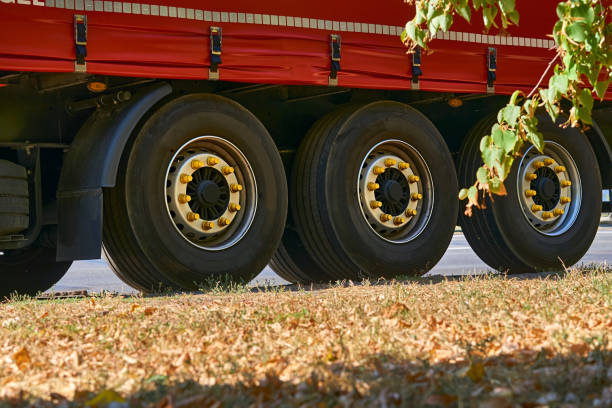new red semi truck set against blue sky
