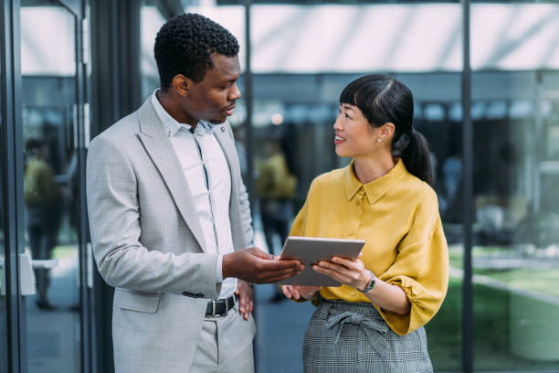 istock Business people using digital tablet outdoors. 2173062308