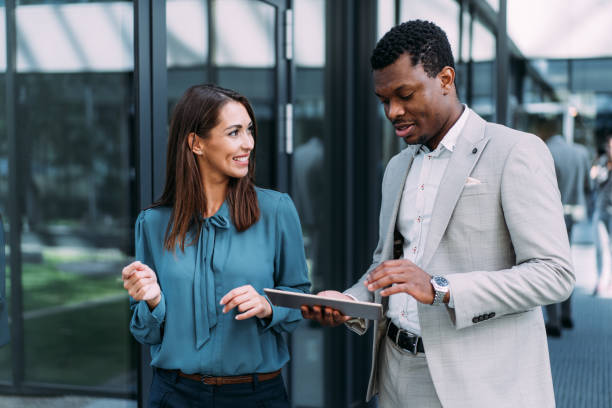 istock Business people using digital tablet outdoors. 2173062318