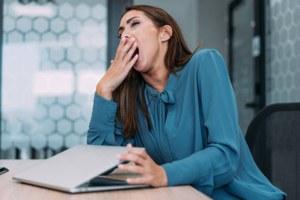 istock Young exhausted businesswoman using laptop in the office. 2173062584