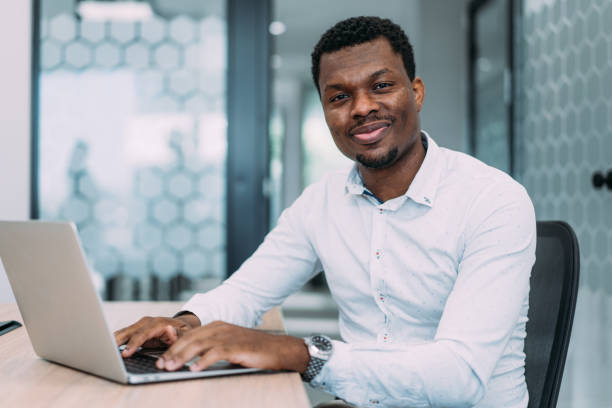 istock Successful businessman in modern office working on laptop. 2173062601