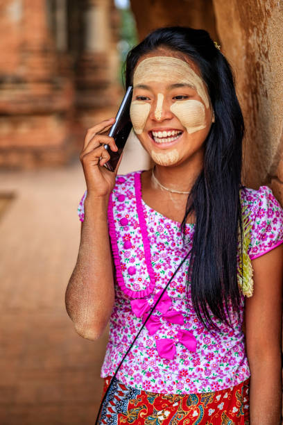 istock Young Burmese girl using a mobile phone in Bagan, Myanmar 2173062616