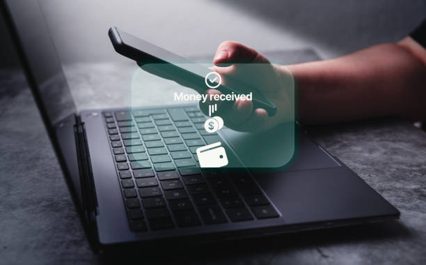 istock Woman transfering money online using apps on smartphone. 2173062690