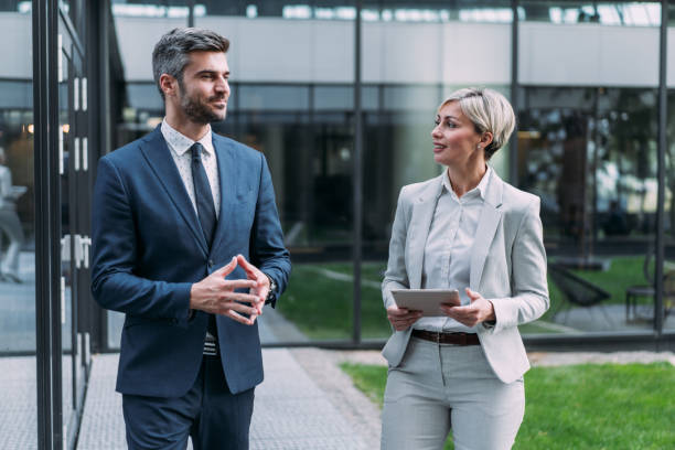 istock Business people using digital tablet outdoors. 2173062800