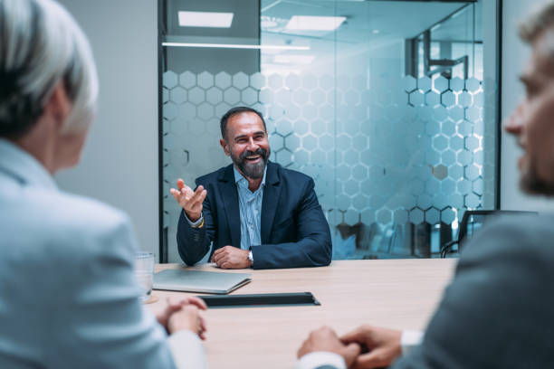 istock Group of business persons talking in the office. 2173062876